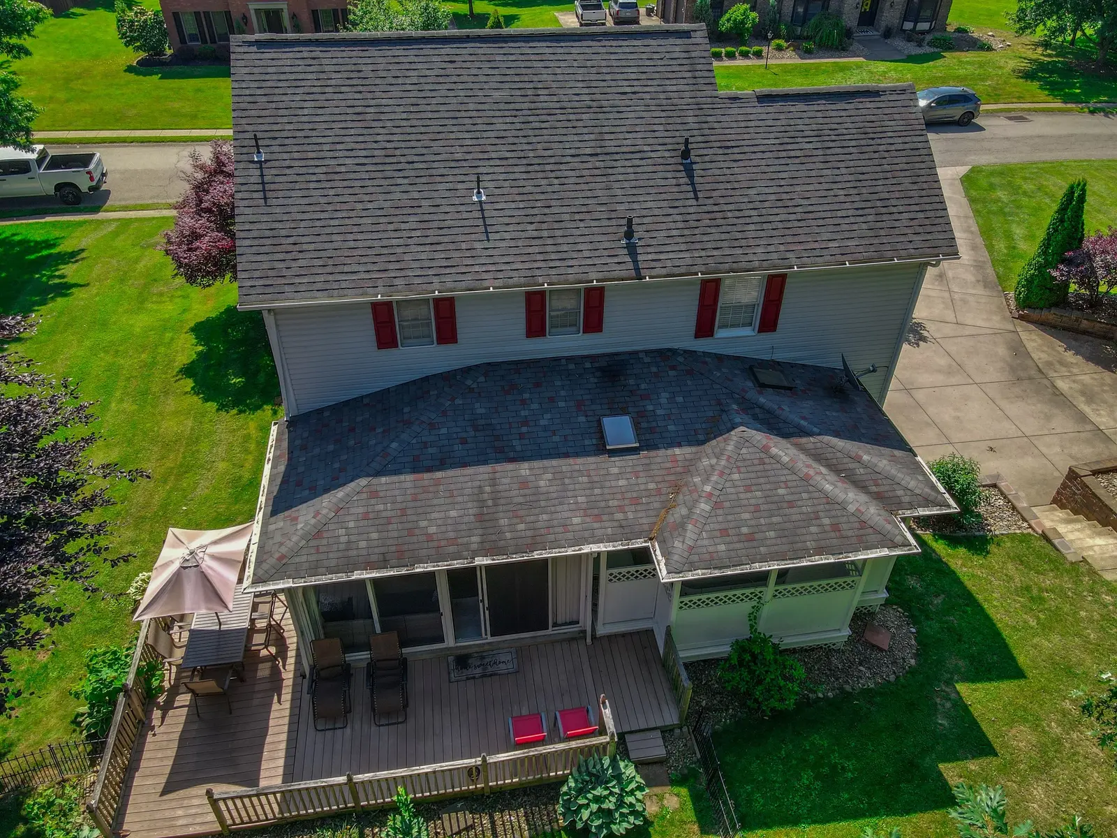 Aerial photo of a residential property showing the house, yard, and lot